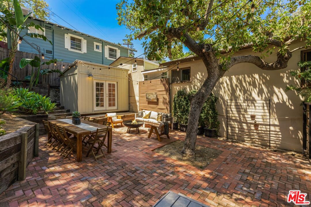 8326 Ridpath Drive Los Angeles, CA 90046 - Photo 18 of 25 a view of a house with backyard porch and sitting area
