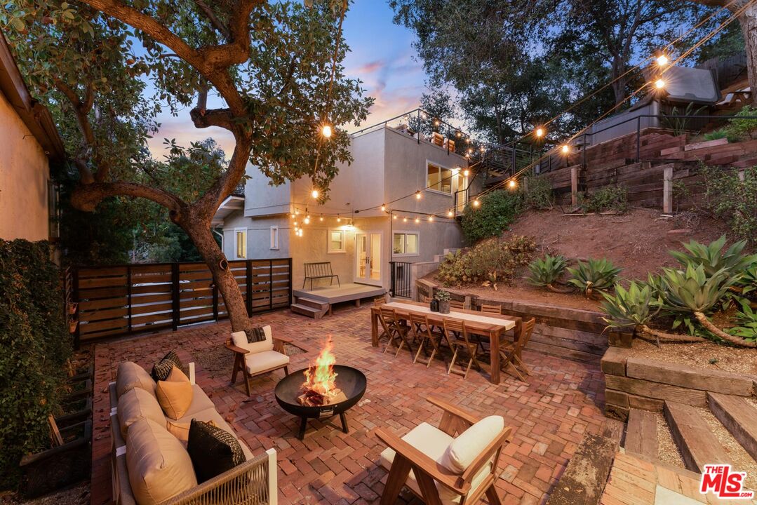 8326 Ridpath Drive Los Angeles, CA 90046 - Photo 2 of 25 a view of a patio with chairs and tables
