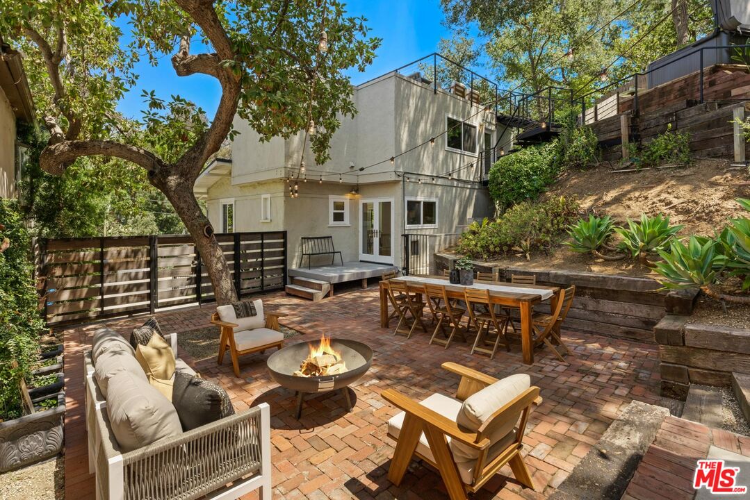 8326 Ridpath Drive Los Angeles, CA 90046 - Photo 21 of 25 a view of backyard of house with seating space
