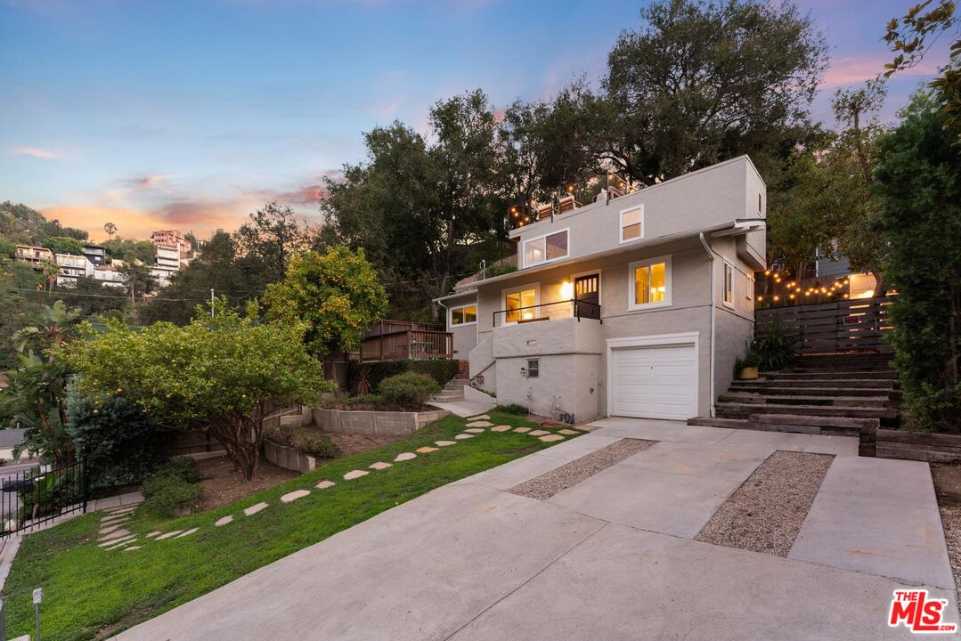 8326 Ridpath Drive Los Angeles, CA 90046 - Photo 3 of 25 a front view of a house with garden