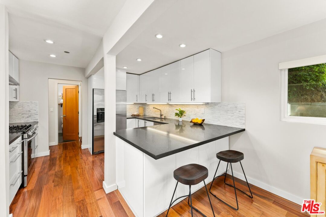 8326 Ridpath Drive Los Angeles, CA 90046 - Photo 7 of 25 a kitchen with counter space and appliances