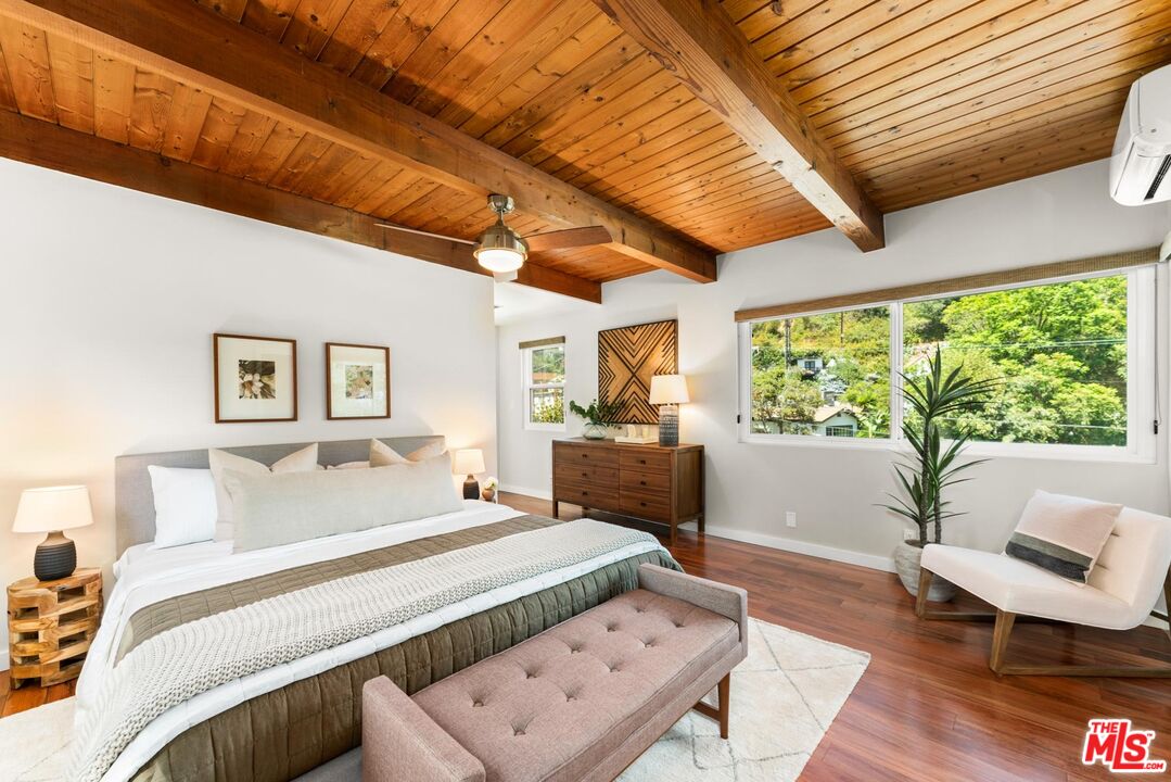 8326 Ridpath Drive Los Angeles, CA 90046 - Photo 9 of 25 a bedroom with furniture and a large window