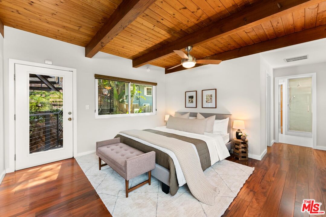8326 Ridpath Drive Los Angeles, CA 90046 - Photo 10 of 25 a spacious bedroom with a bed and wooden floor