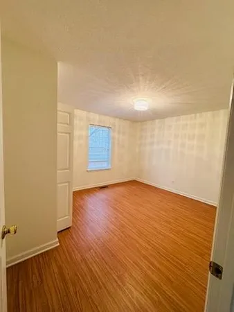 a room that has a sink and a mirror in it