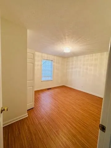 a room that has a sink and a mirror in it