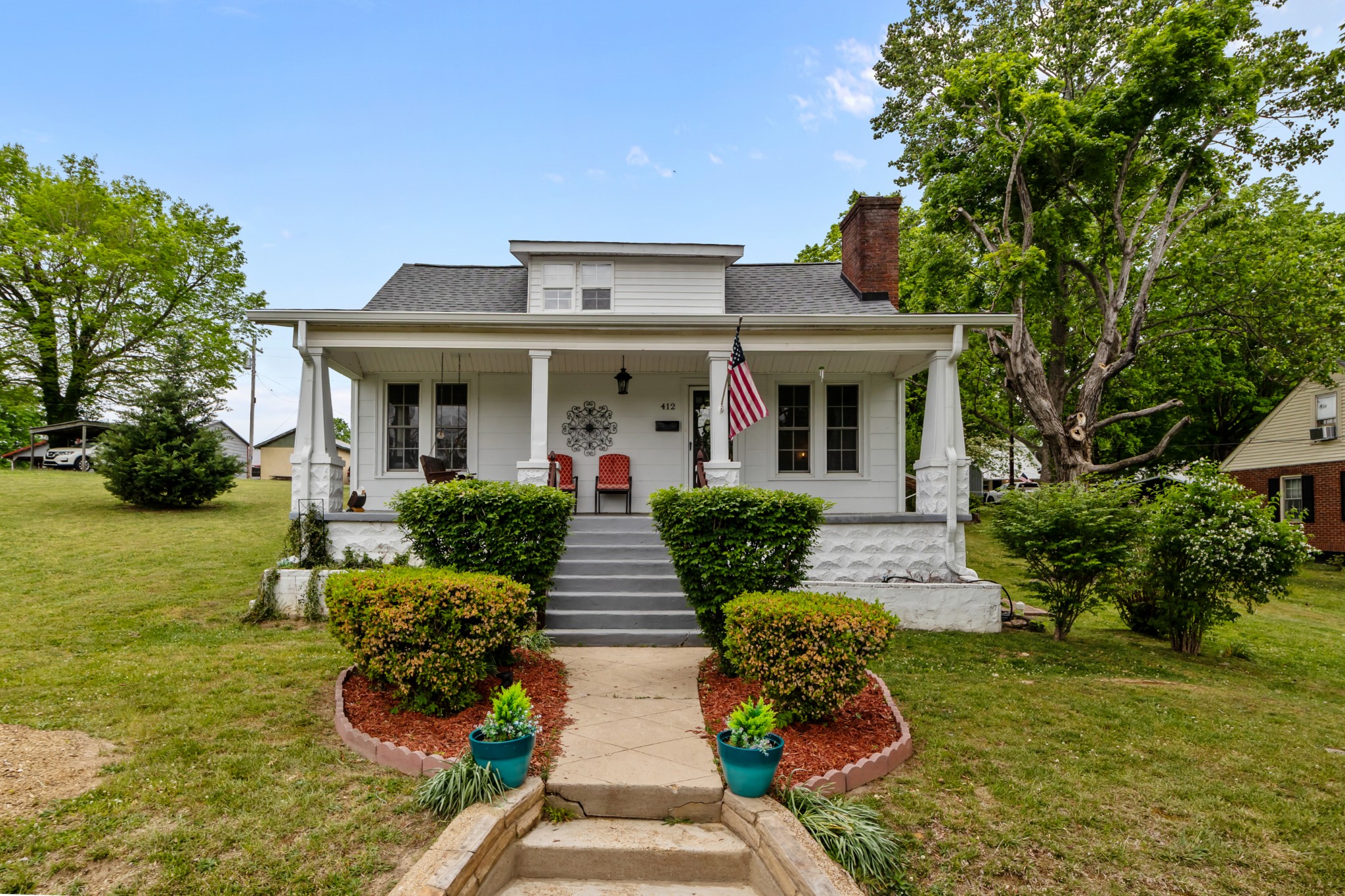 412 High Street Dickson, TN 37055 - Photo 1 of 42 a front view of a house with garden