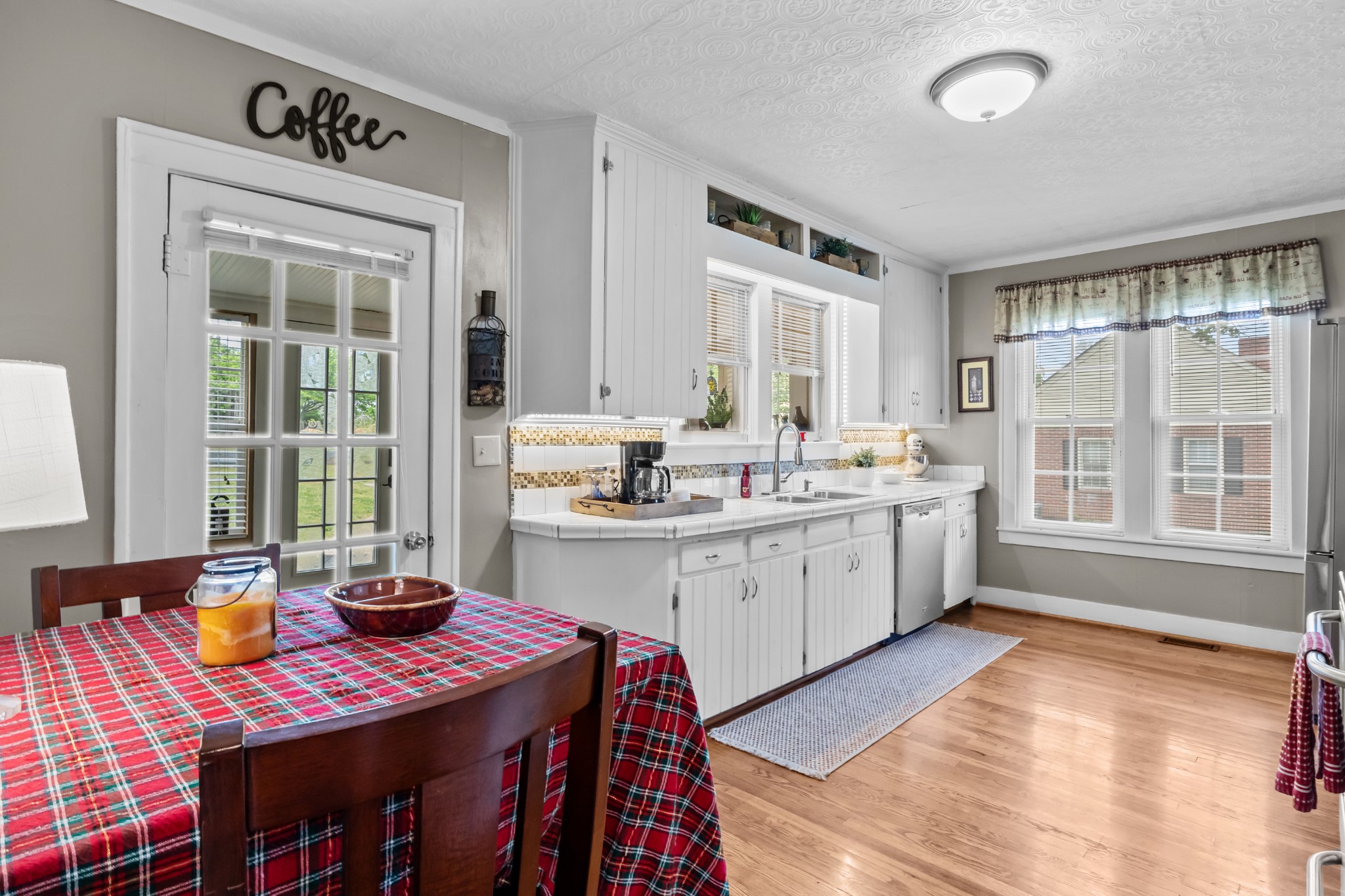 412 High Street Dickson, TN 37055 - Photo 13 of 42 a kitchen that has a lot of cabinets in it and a window