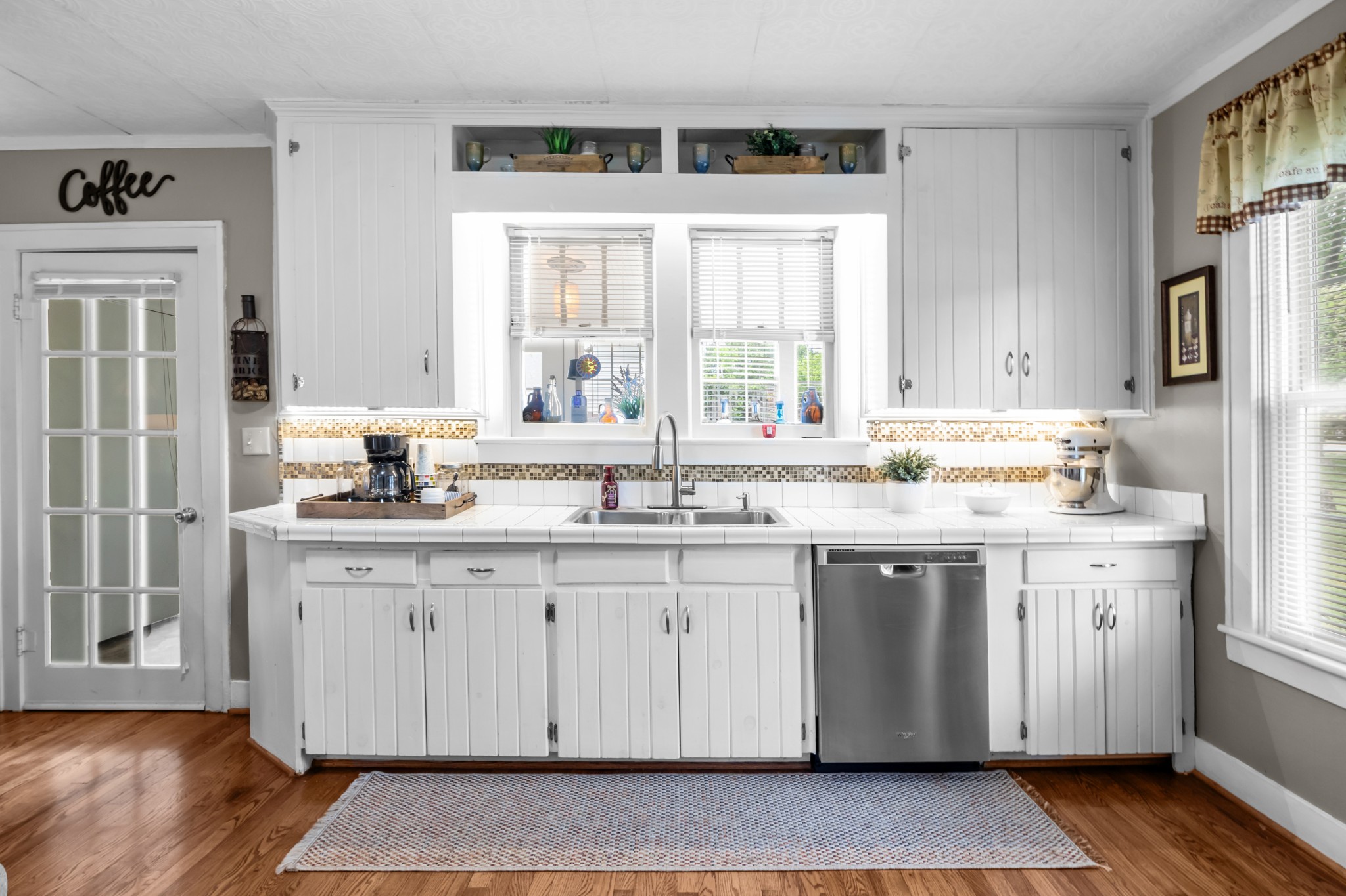 412 High Street Dickson, TN 37055 - Photo 14 of 42 a kitchen with stainless steel appliances granite countertop a sink cabinets and wooden floor