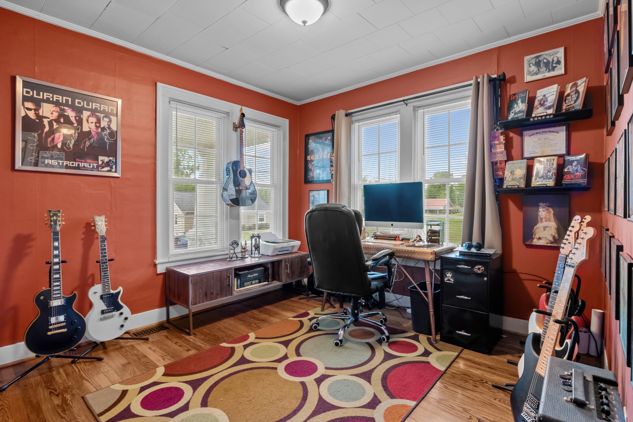 412 High Street Dickson, TN 37055 - Photo 22 of 42 a living room with furniture a rug and a flat screen tv