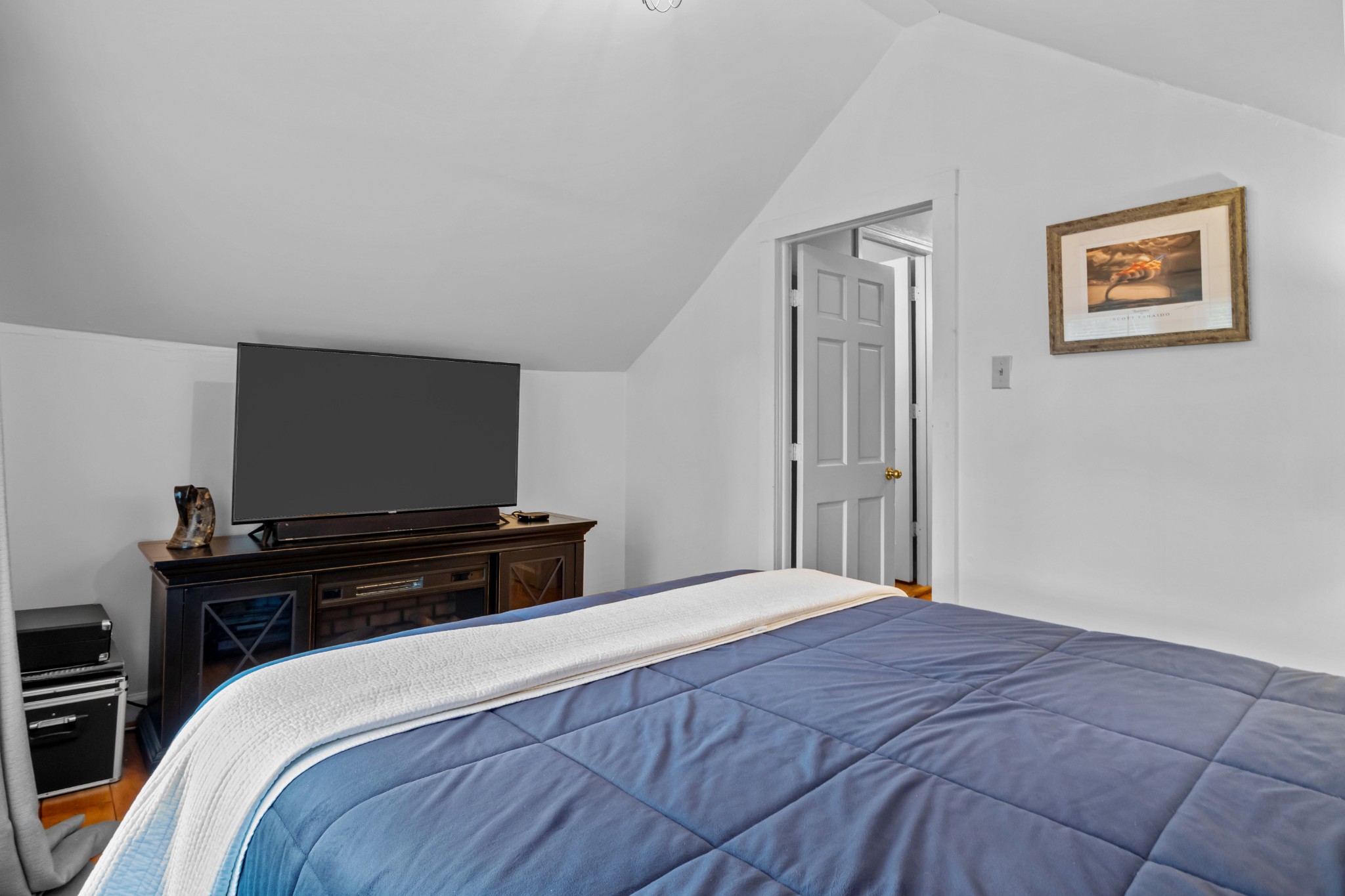 412 High Street Dickson, TN 37055 - Photo 32 of 42 a bedroom with a bed and a flat screen tv