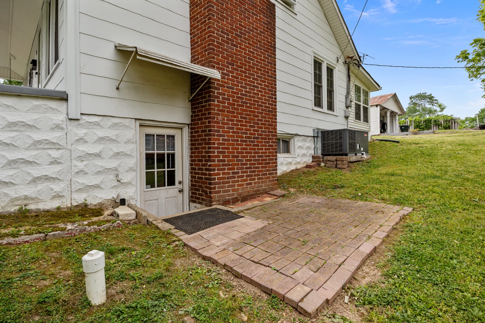 412 High Street Dickson, TN 37055 - Photo 34 of 42 a view of a white house with a yard