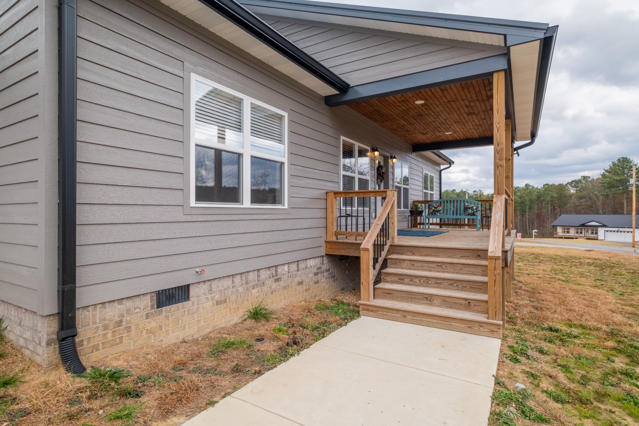 55 Rustling Pnes Road Dunlap, TN 37327 - Photo 3 of 33 a view of a patio with table and chairs with wooden floor and fence