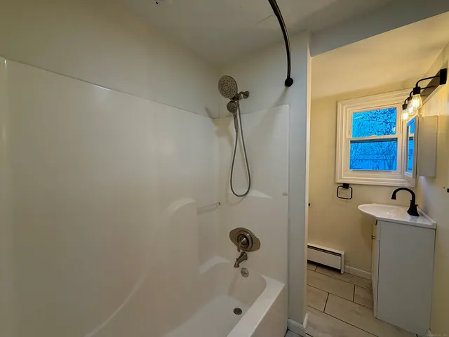 a bathroom with a sink and a bathtub