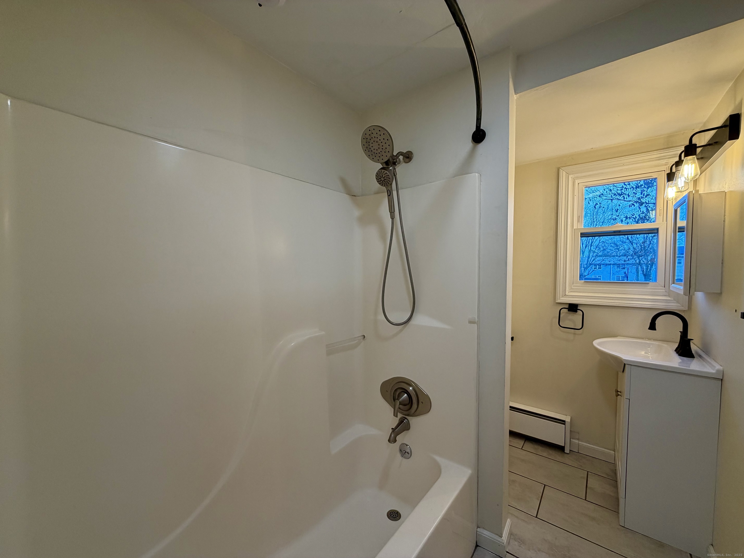 21 Weybosset Street, Unit 3 New Haven, CT 06513 - Photo 11 of 11 a bathroom with a sink and a bathtub