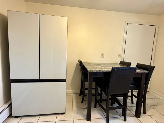 a view of a dining table and chairs in the kitchen