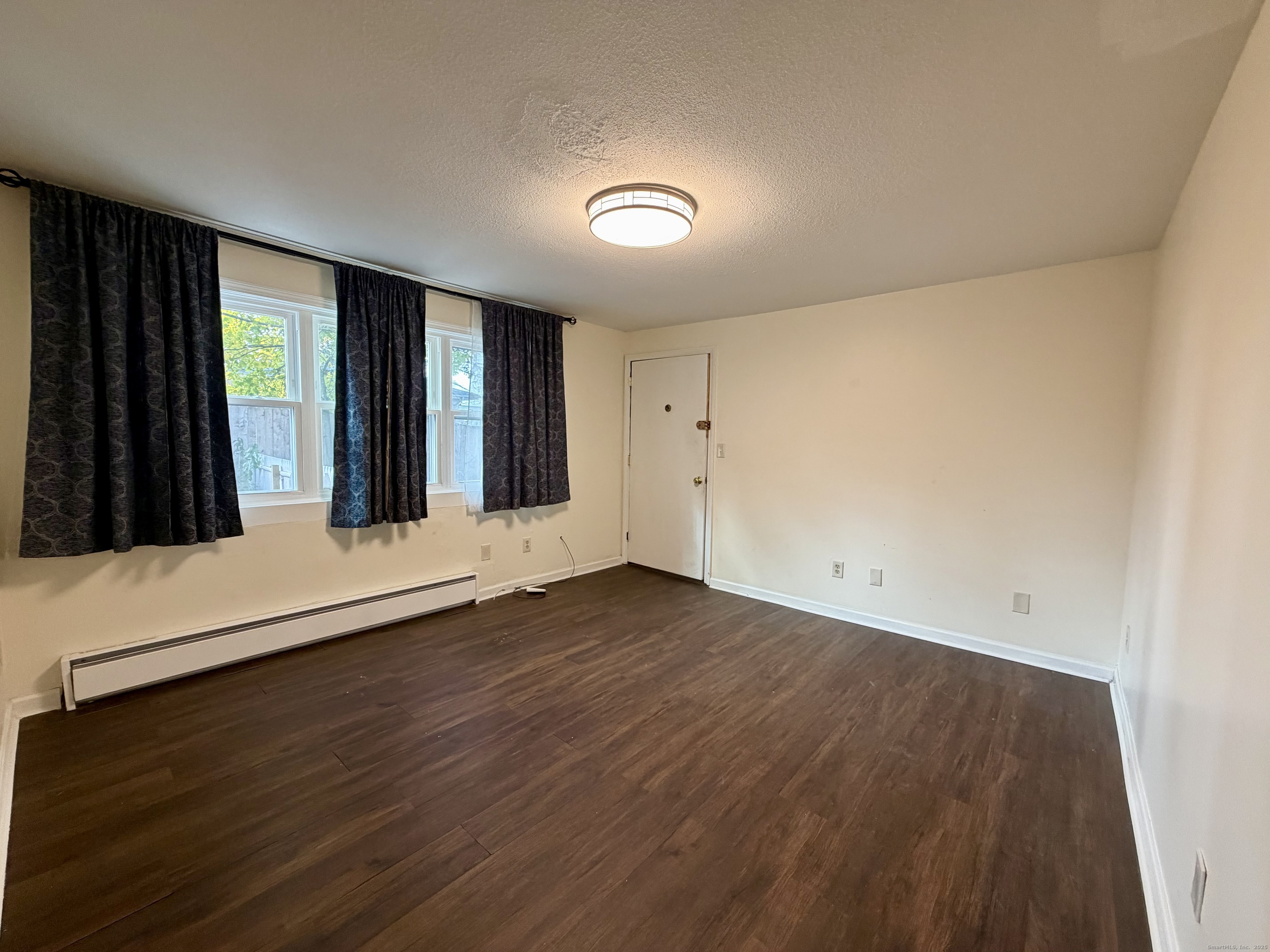21 Weybosset Street, Unit 3 New Haven, CT 06513 - Photo 6 of 11 an empty room with wooden floor and windows