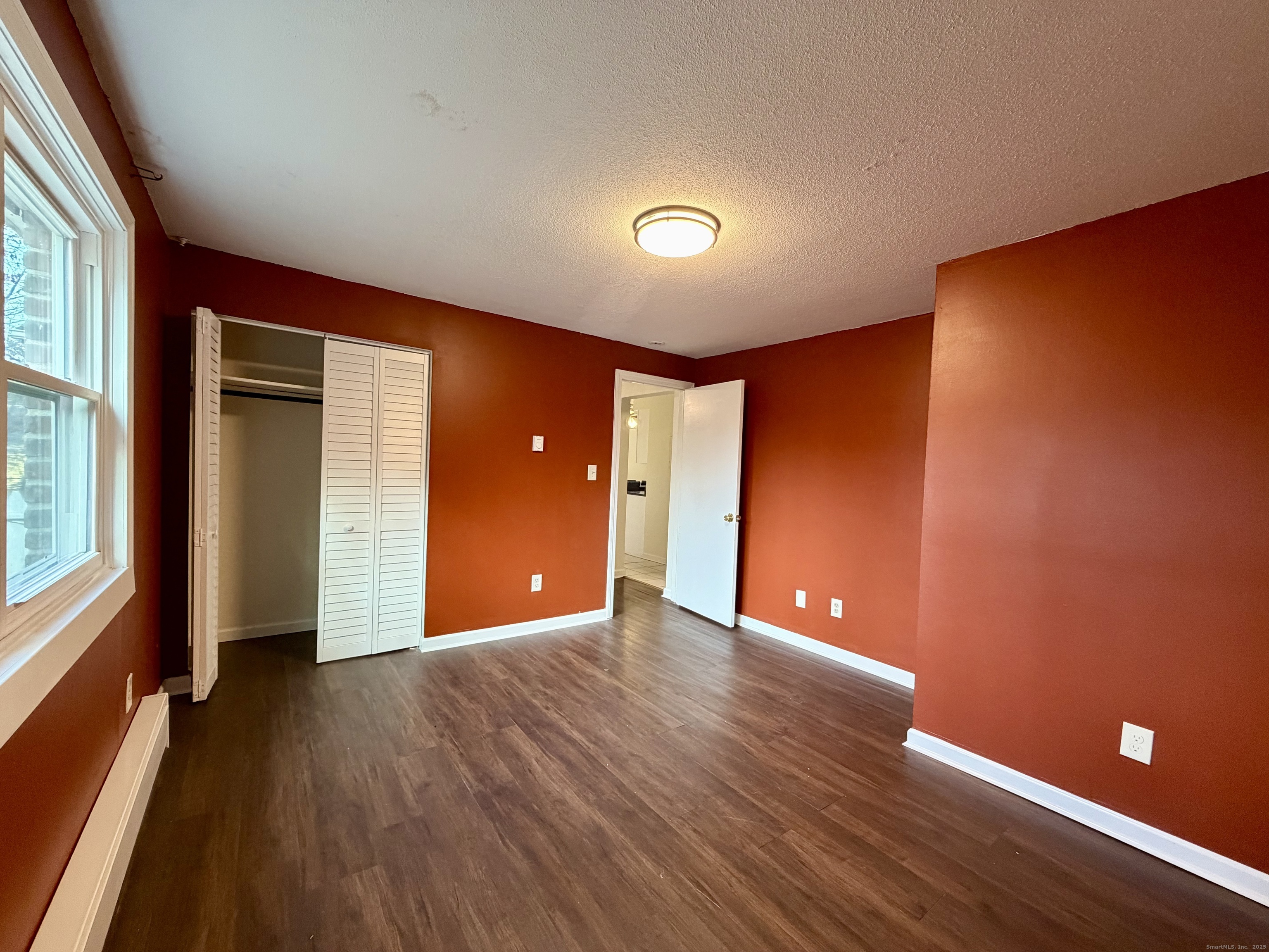 21 Weybosset Street, Unit 3 New Haven, CT 06513 - Photo 7 of 11 a view of an empty room with wooden floor and a window