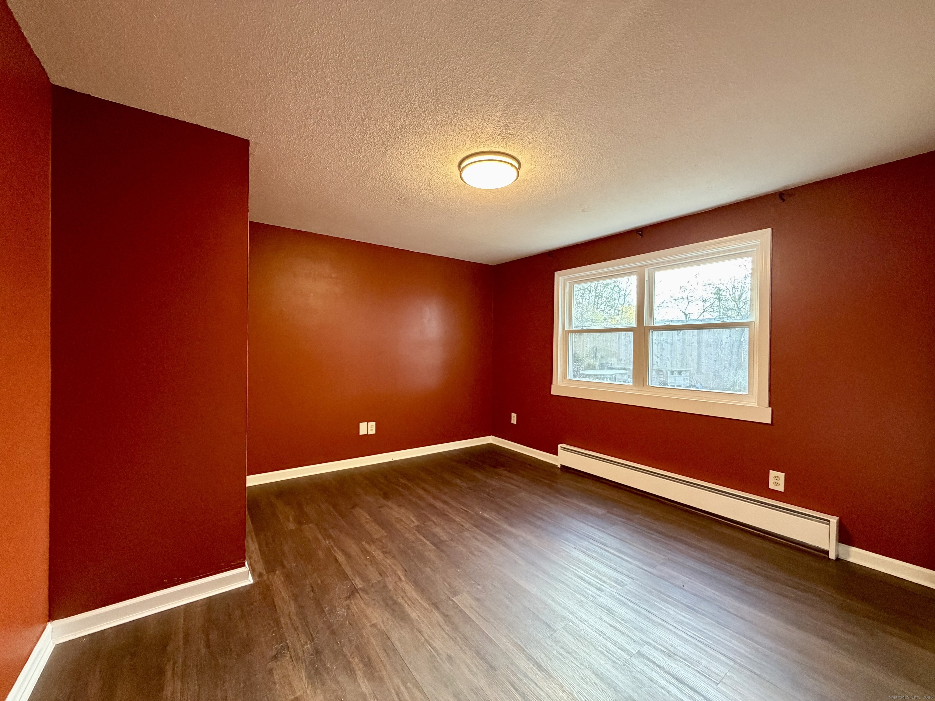 21 Weybosset Street, Unit 3 New Haven, CT 06513 - Photo 8 of 11 an empty room with wooden floor and windows