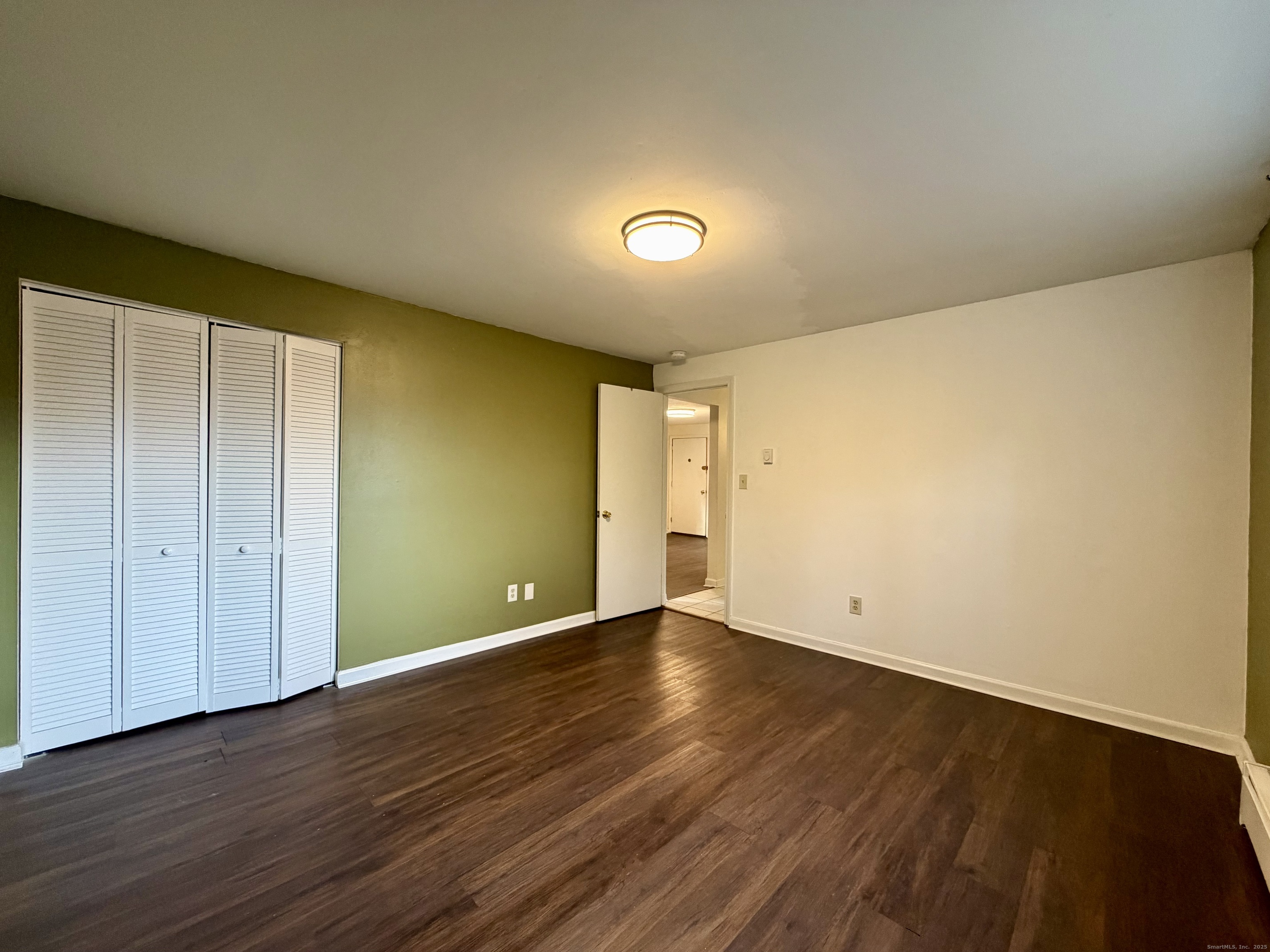 21 Weybosset Street, Unit 3 New Haven, CT 06513 - Photo 9 of 11 a view of an empty room with wooden floor