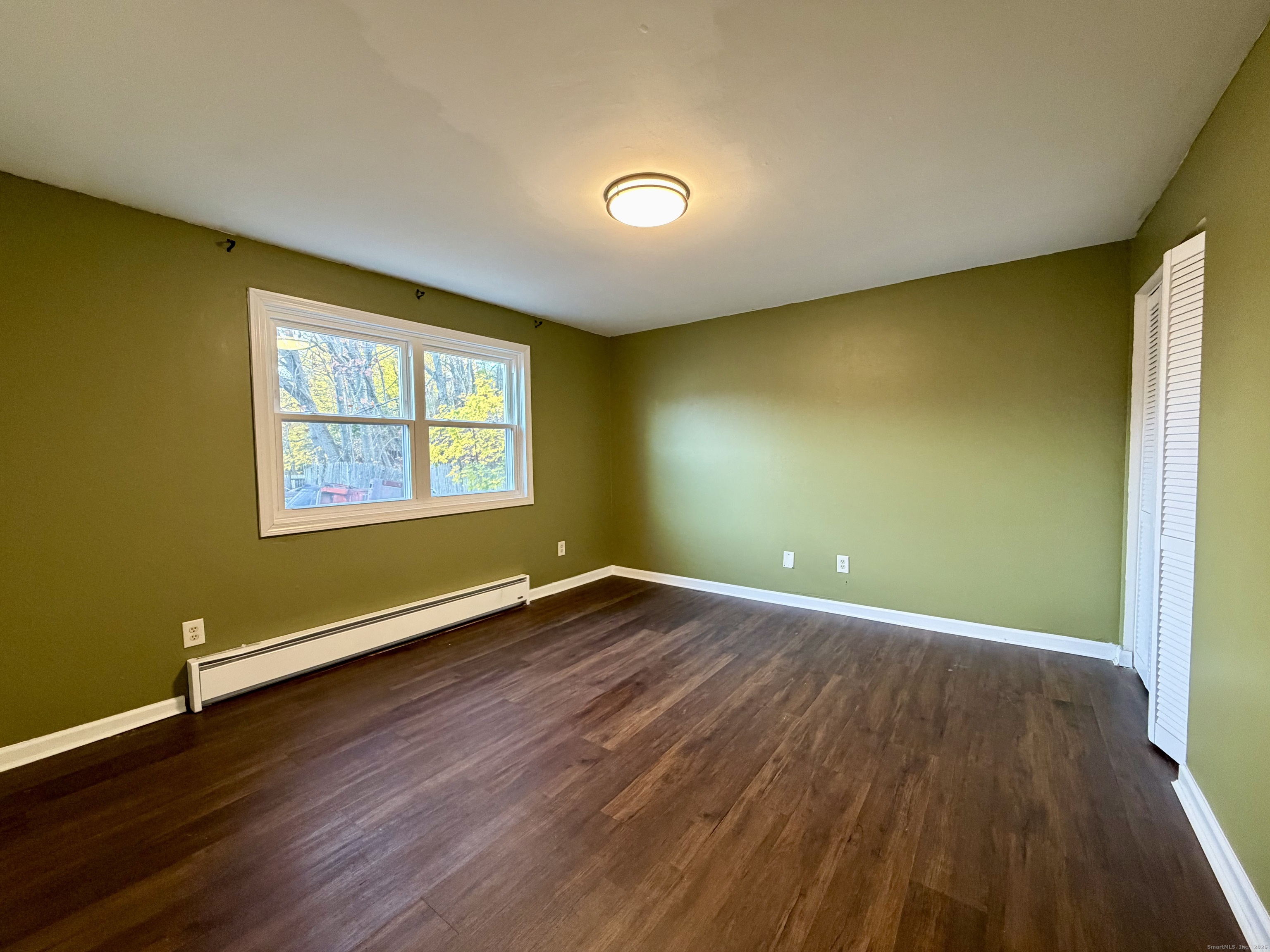 21 Weybosset Street, Unit 3 New Haven, CT 06513 - Photo 10 of 11 a view of an empty room with wooden floor and a window