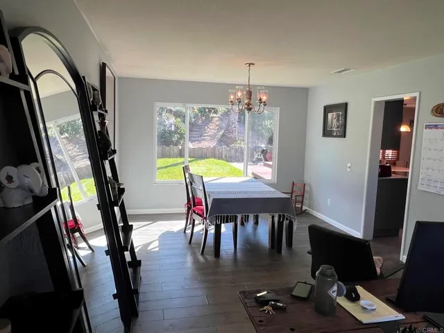 a dining room with furniture and window