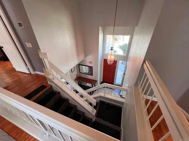 a view of an empty room with a fireplace