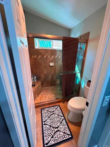 a bathroom with a sink and a glass door
