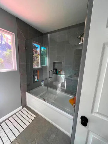 a bathroom with a sink and a bathtub