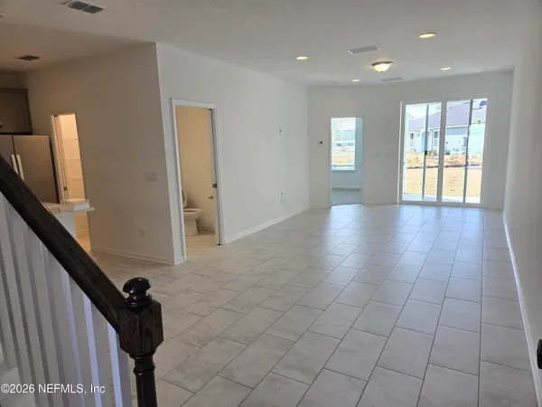 a view of an empty room and window
