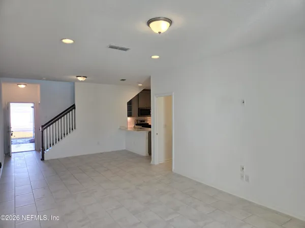 a view of a hallway with a room
