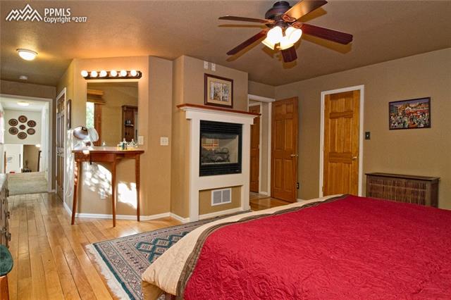 1129 Cresta Road Colorado Springs, CO 80905 - Photo 16 of 35 Master bedroom with 2 way fireplace.