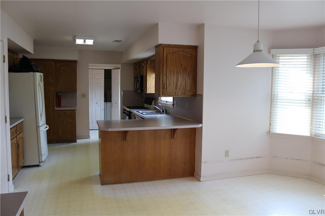4190 Alder Road Bethlehem, PA 18020 - Photo 4 of 27 a kitchen with stainless steel appliances granite countertop a refrigerator and a sink