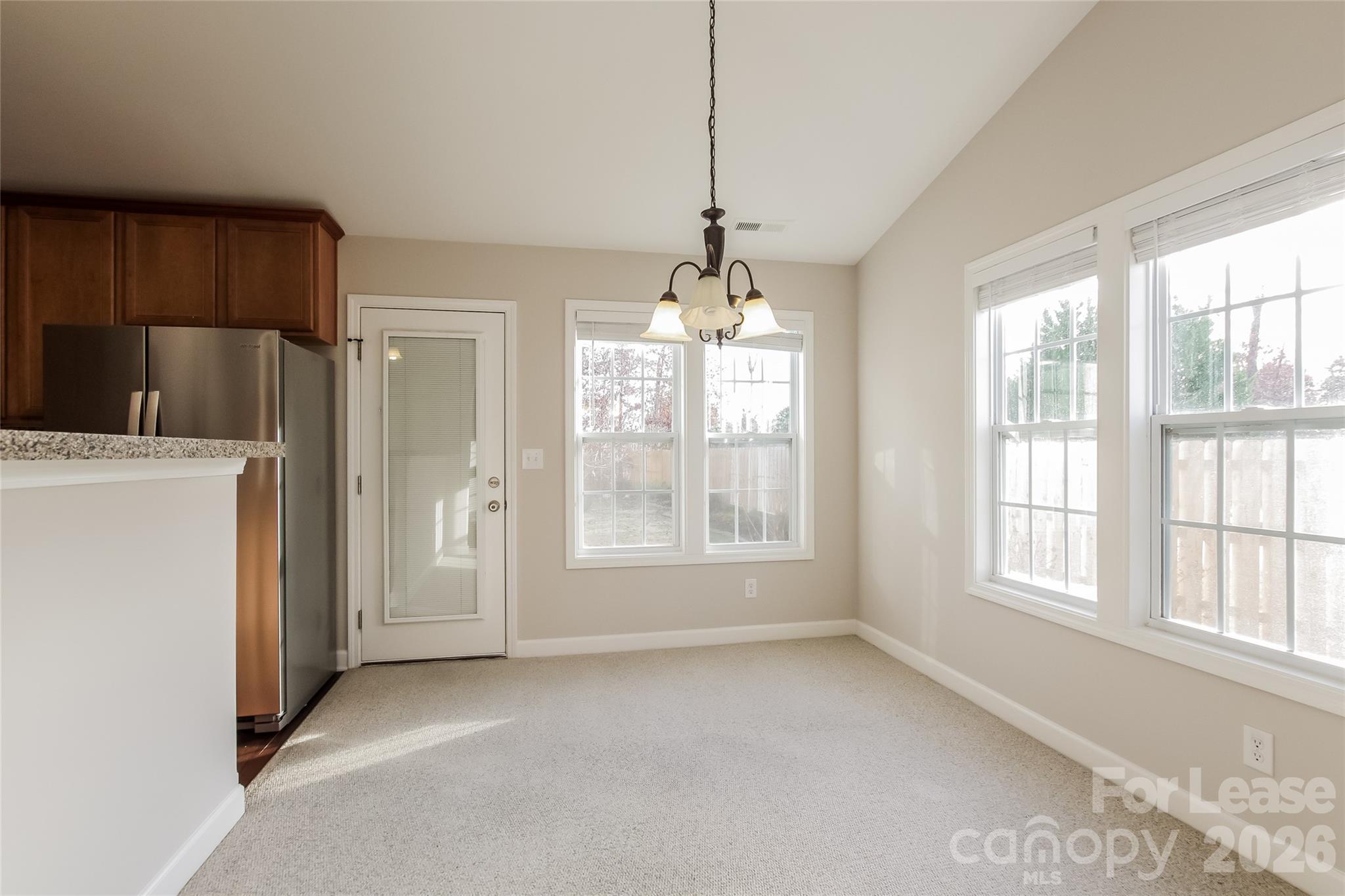 11647 Tucker Field Road Midland, NC 28107 - Photo 5 of 15 a view of an empty room with a window