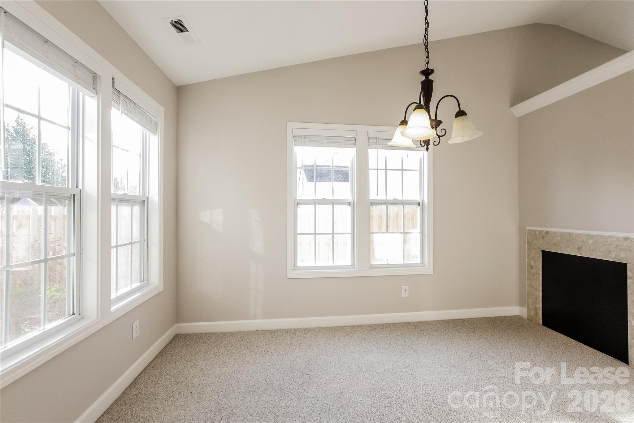 11647 Tucker Field Road Midland, NC 28107 - Photo 8 of 15 a view of an empty room with a window and fireplace