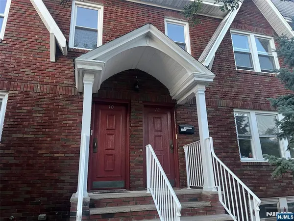 a front view of a house with wooden stairs