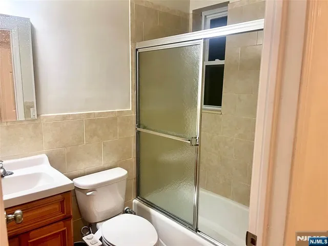 a bathroom with a shower and toilet