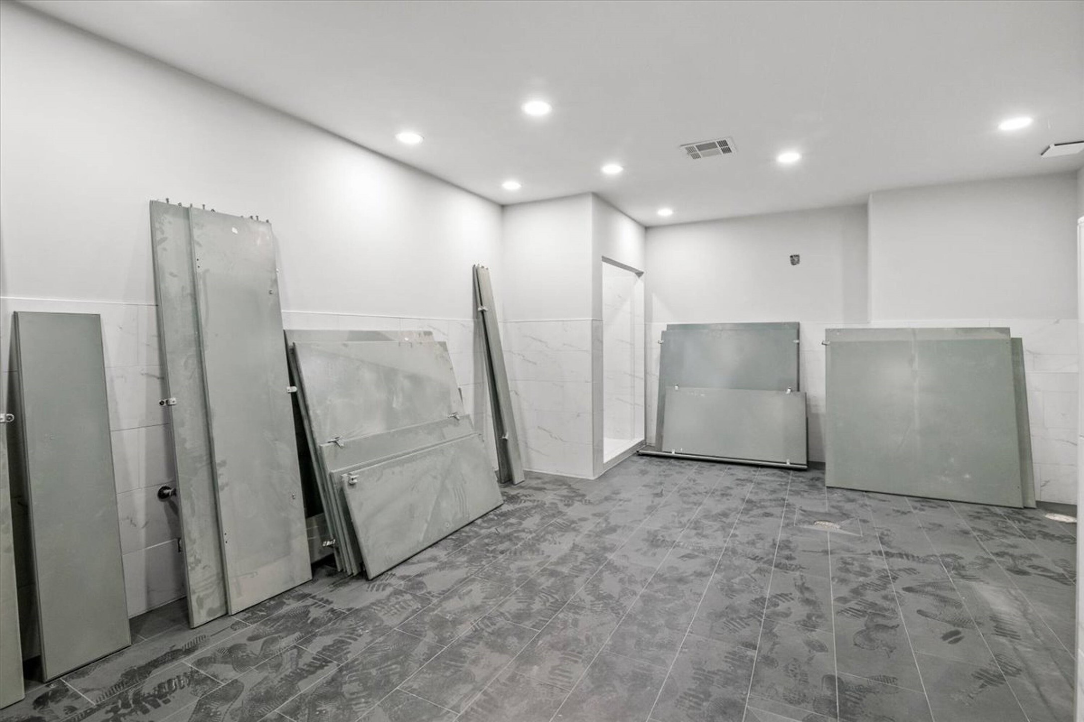 375 King Rea Spur Georgetown, TX 78633 - Photo 12 of 29 Room featuring grey-toned tile flooring, recessed lighting, and white walls