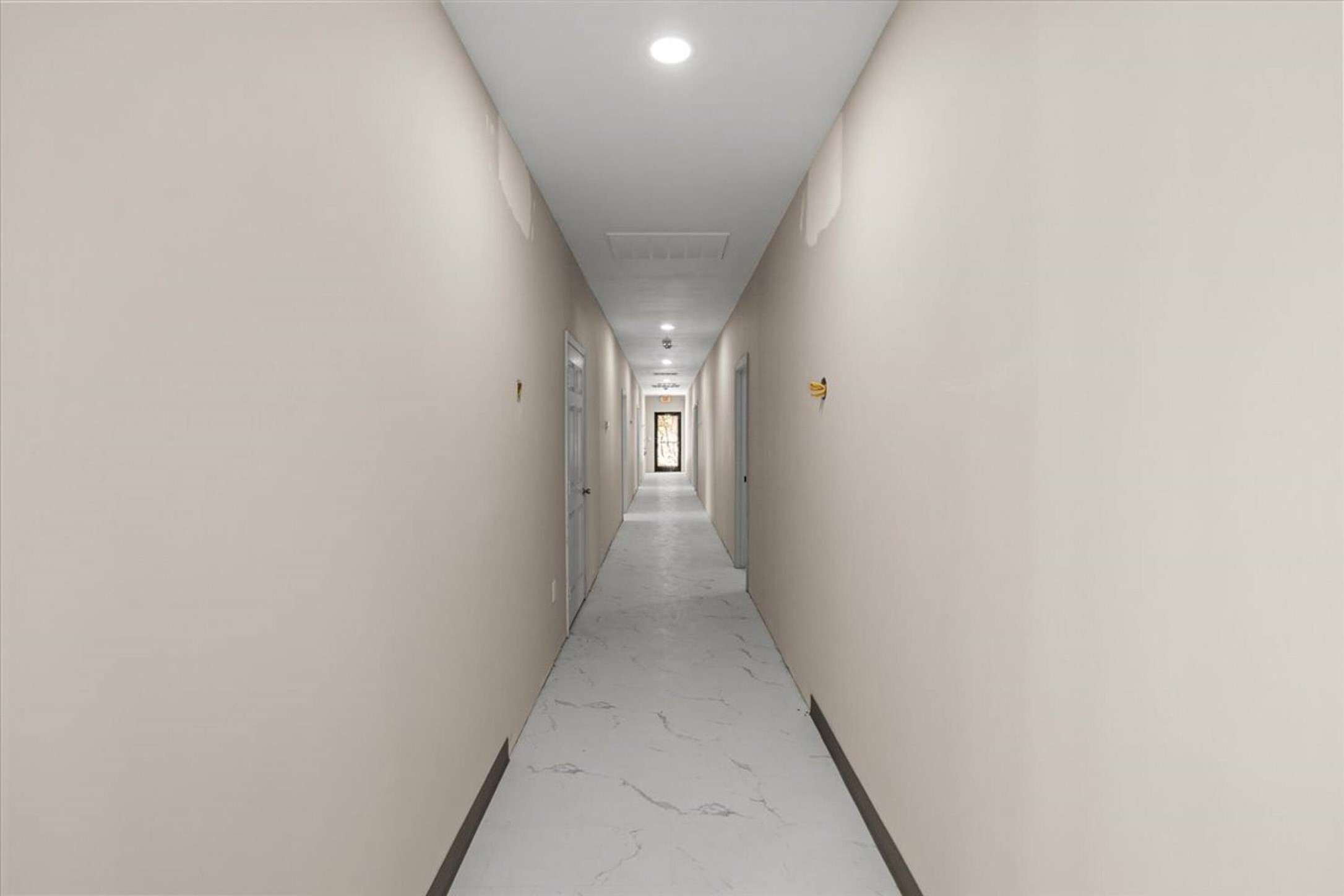 375 King Rea Spur Georgetown, TX 78633 - Photo 17 of 29 Long hallway featuring recessed lighting, light-toned walls, and tile flooring