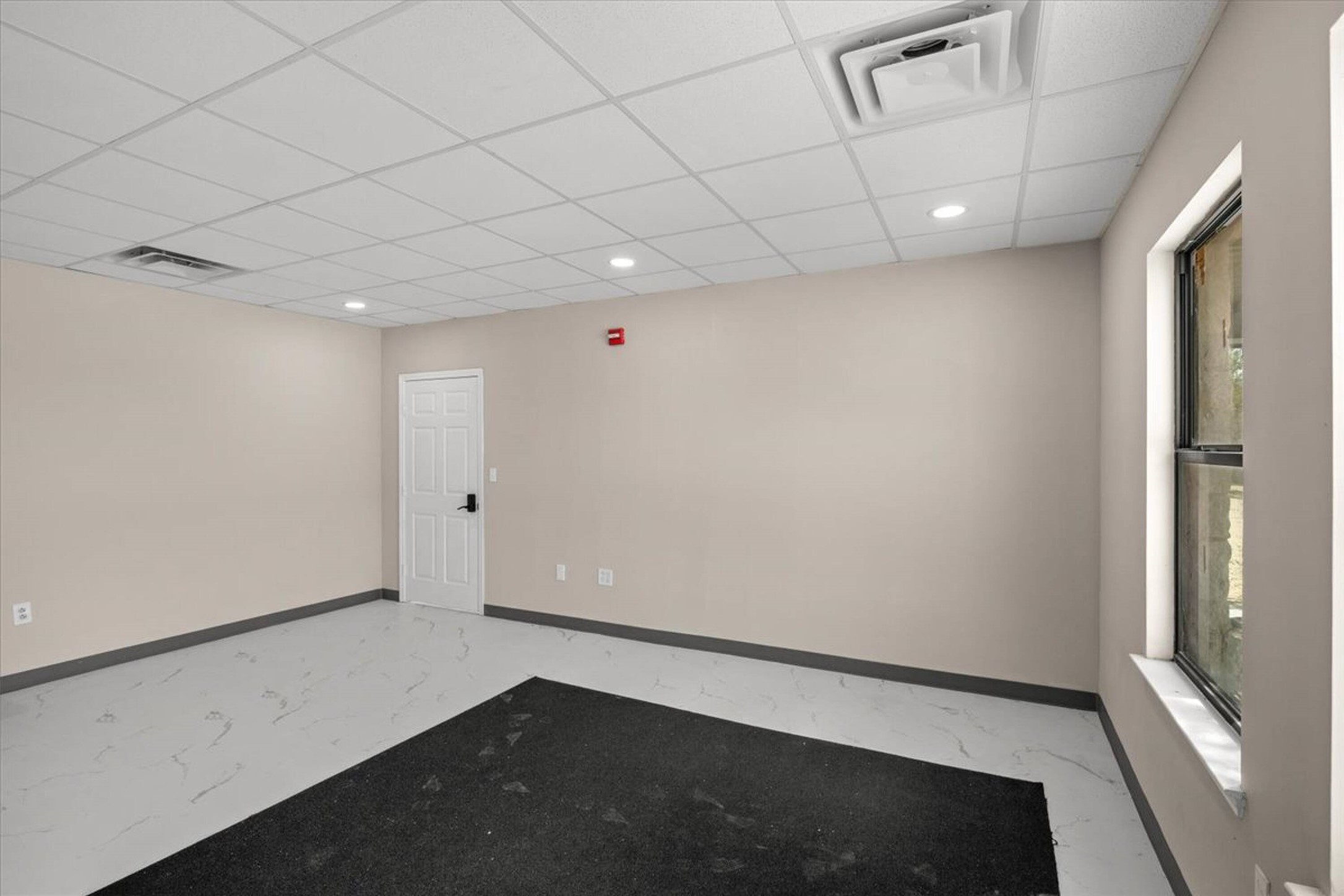 375 King Rea Spur Georgetown, TX 78633 - Photo 18 of 29 Open room featuring drop ceiling, recessed lighting, neutral wall paint, and white trim