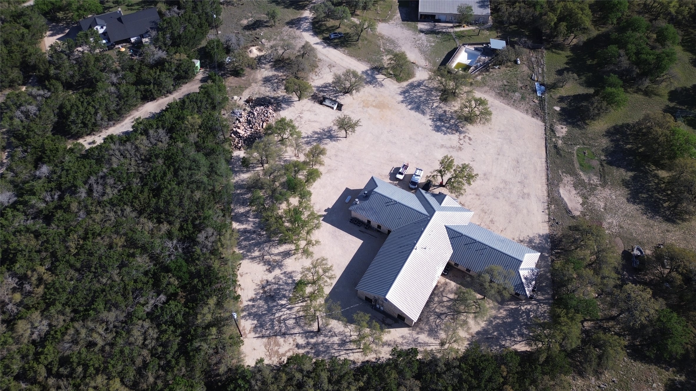 375 King Rea Spur Georgetown, TX 78633 - Photo 29 of 29 Expansive property featuring a distinctive multi-wing structure with a light-colored metal roof