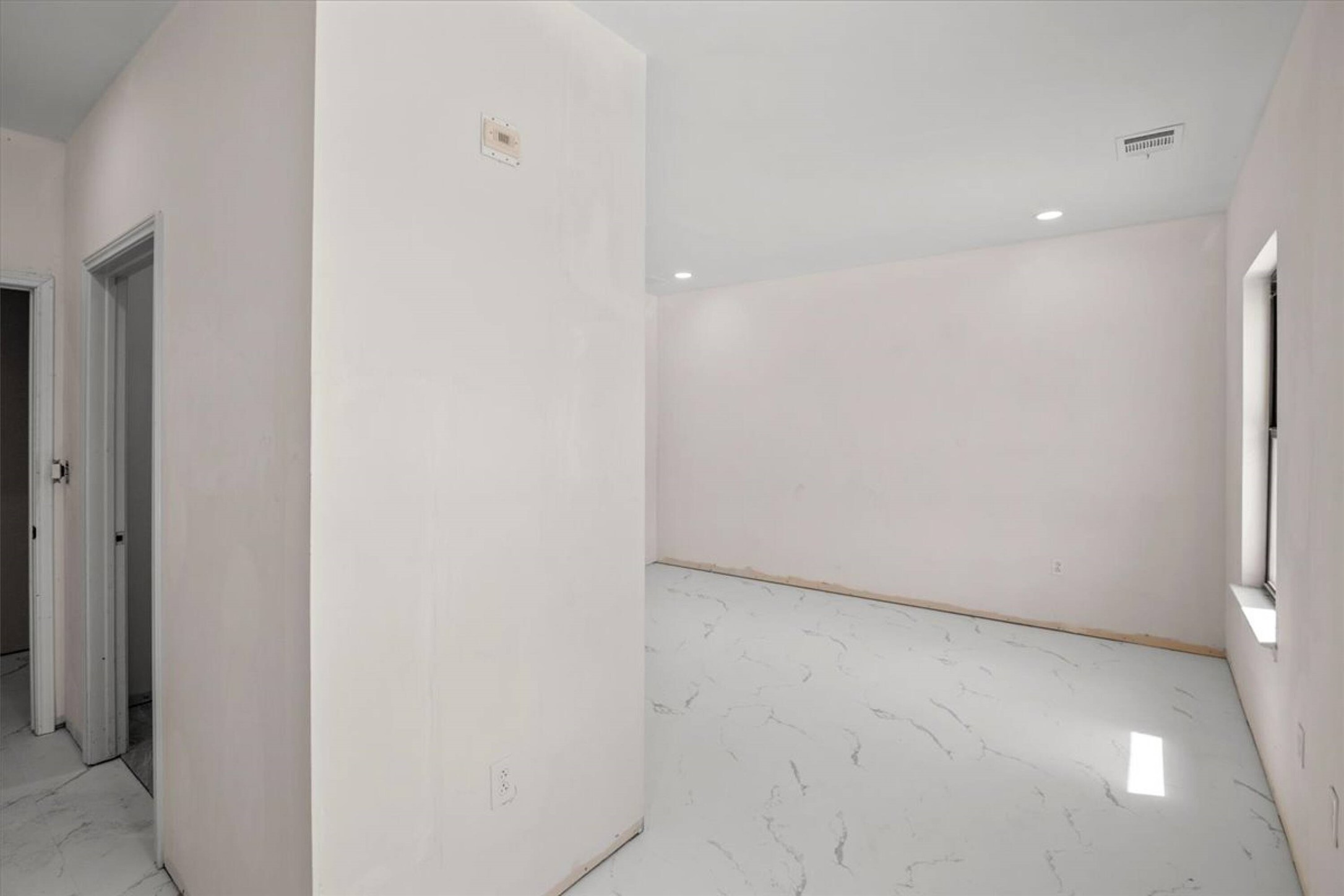 375 King Rea Spur Georgetown, TX 78633 - Photo 4 of 29 Spacious interior room featuring white walls, recessed lighting, and a window with natural light