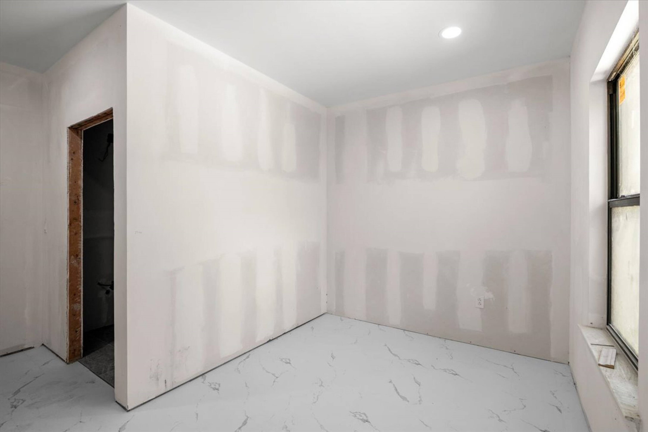 375 King Rea Spur Georgetown, TX 78633 - Photo 7 of 29 Room with unfinished drywall, a single window, and a recessed ceiling light