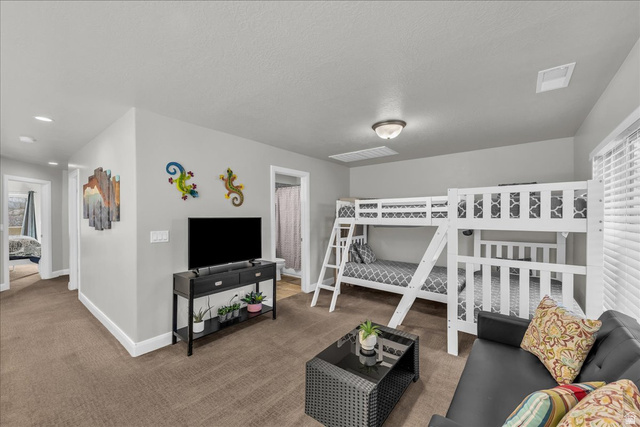 4796 Winged Foot Drive St. George, UT 84770 - Photo 31 of 33 Bedroom featuring carpet floors and baseboards
