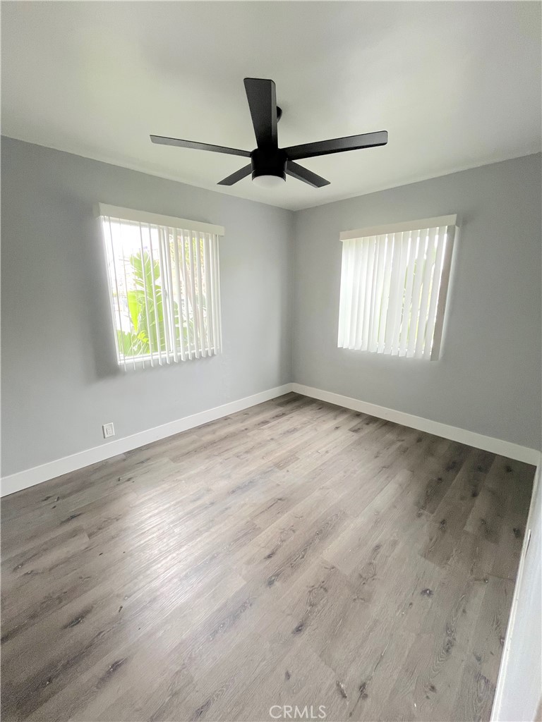 2403 Louella Avenue, Unit 3 Venice, CA 90291 - Photo 7 of 15 a view of an empty room with wooden floor and a window