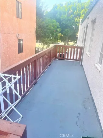 a view of balcony with furniture