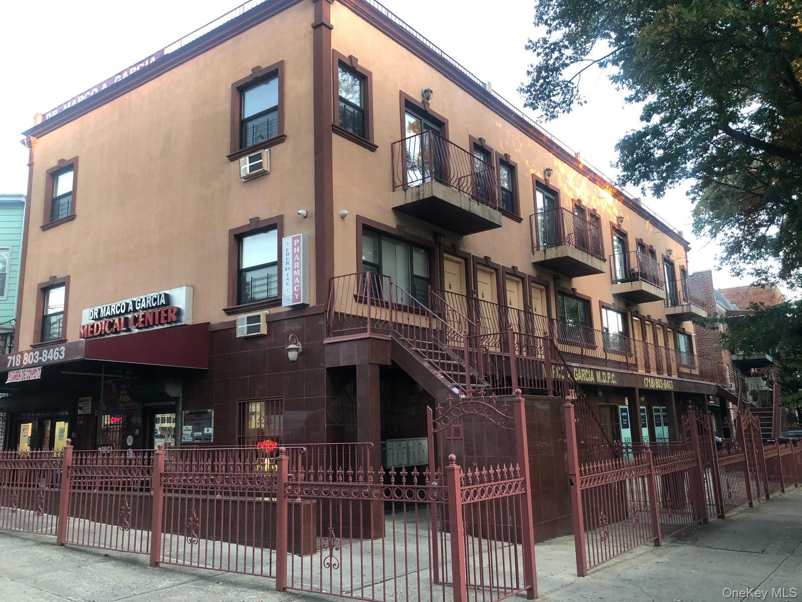 40-35 95th Street, Unit 2A Queens, NY 11373 - Photo 9 of 11 a front view of a building with glass windows