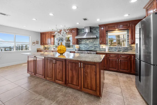 a view of a big room with chandelier and windows