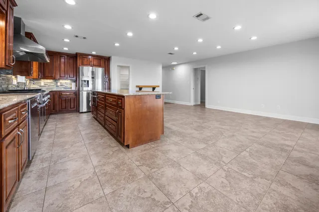 a view of a hallway with stairs