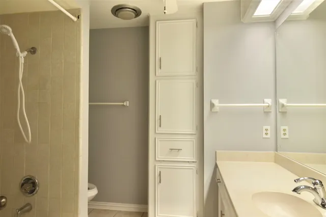 a bathroom with a tub and shower