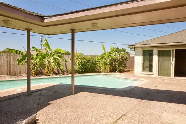 a view of a backyard of a house